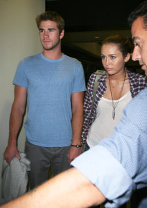 Miley Cyrus seen with her boyfriend Liam Hemsworth on june 16th 2010 as they arrive at LAX airport 3