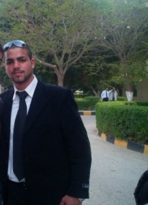 Mohamed Ramadan wearing a black suit