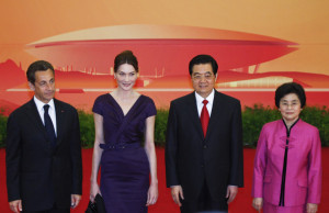 Carla Bruni Sarkozy and her husband President Nicolas Sarkozy during a welcome ceremony at the Opening of the World Expo on April 30th 2010 in Shanghai China 1