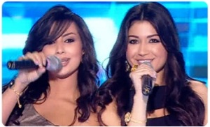 picture of Christine Saadeh and Yasmine Hajjoul singing on stage at the third prime of star academy season eight on April 15th 2011