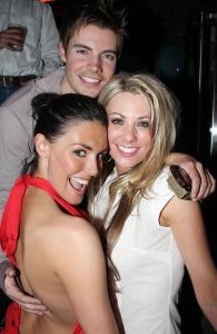 Taylor Cole seen wearing a backless red blouse at The Bank Nightclub at Bellagio on March 1st 2009 along with Josh Henderson and Jodi Myers