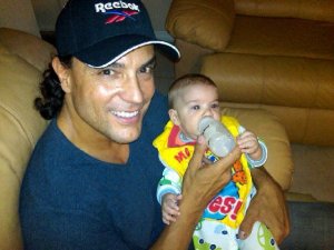 Osvaldo Rios personal photos with a baby 1