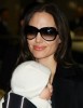 Angelina Jolie carrying her son Vivienne Marcheline who is still six months old at Narita International Airport on January 27th in Narita  Chiba  Japan