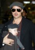 Brad Pitt carrying his son Knox Leon who is still six months old at Narita International Airport on January 27th in Narita  Chiba  Japan