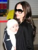 Angelina Jolie holding six-moths old Vivienne Marcheline as she arrives with her family at the Narita International Airport