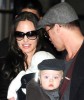 Brad Pitt and Angelina Jolie both carrying the baby twins Vivienne Marcheline and Knox Leon