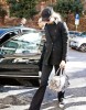 Nicole Kidman arrives at the filming set of Nine wearing denim pants and tall black boots