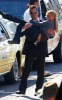 Hayden Panettiere pink thong showing while carried by co-star Adrian Pasdar while filming a new epsiode of heroes