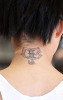 Katie Price back neck tattoo