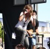 Brittany Flickinger on stage in an outdoor concert