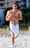 Michael Phelps naked chest on the beach playing volleyball