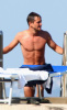 Hugh Dancy topless on the beach