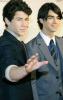 Joe Jonas and Nick Jonas arrive at the 2009 MusiCares Person of the Year Tribute in Los Angeles