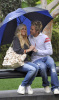 Heidi Montag and Spencer Pratt kissing under the rain