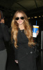 Lindsay Lohan lands in New York City JFK International Airport