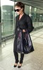 Victoria Beckham was spotted catching a plane at London s Heathrow International Airport to land at Milan Airport in Italy 5