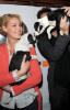 Katherine Heigl and her husband Josh Kelley playing with lil puppies during the Mutts To Melrose event on February 11th 2009 5