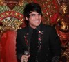 Adam Lambert black suit and neck tie