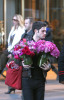 Penn Badgley leaves a midtown Manhattan hotel with flowers on the morning of February 16th 2009