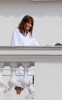 Carla Bruni Sarkozy at the balcony of her hotel room in the Copacabana Palace while on vacation on December 22nd 2008