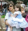 Katie Holmes carrying her daughter Suri Cruise while on a magical trip at Walt Disney