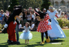 Suri Cruise with Mickey and Minnie Mouse