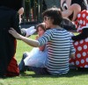 Suri Cruise with Mickey and Minnie Mouse