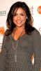 Rachael Ray wearing a gray sweater