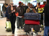 Kanye West and Amber Rose both arrive in Paris France to attend fashion week on March 7th 2009