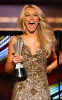 Julianne Hough gets her award at the 44th annual country music awards on April 5th 2009