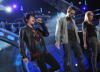 Adam Lambert with Matt Giraud and Megan Joy Corkrey performing live on American Idol Season 8 Top 9 Elimination Show on April 1st 2009 in Los Angeles California