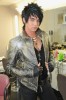 Adam Lambert in a silver leather jacket