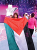 Diala Odeh with a palestinian flag as she leaves star academy on stage of the LBC Star Academy Ninth Prime