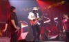 Adam Lambert and Kris Allen performing with Santana on stage