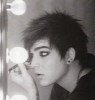 Adam Lambert backstage putting makeup