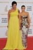 Kim Kardashian arrives on the red carpet of the 49th Annual Monte Carlo Television Festival Closing Ceremony on 11th June 2009 wearing a glam strapless silver dress with her morther Kris Jenner in the long yellow dress