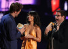 Vanessa Hudgens and Jonah Hill presenting actor Robert Pattinson with the Breakthrough Male Performance award onstage during MTV Movie Awards on May 31st 2009