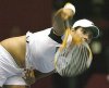 Sania Mirza during a tennis game returning the ball