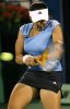 Sania Mirza during a tennis game in a blue top