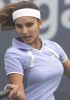 Sania Mirza during a tennis game in a light blue outfit