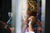 Myriam Atallah picture from her video clip at a phone booth