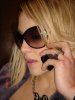 Salma Ghazali picture wearing large sun glasses and talking on the phone