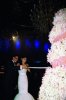 Haifa Wehbe picture from her wedding to Abu Hashima cutting the huge floral wedding cake