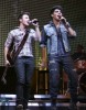 Adam Lambert and Kris Allen on stage during the 2009 American Idols Live tour at Staples Center on July 16th 2009 in Los Angeles California 1