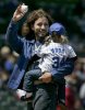 Eddie Vedder holds his daughter Olivia at a baseball game between the San Diego Padres and Chicago Cubs on May 14th 2006 in Chicago 2