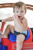 Matteo picture as he plays at the beach with his twin baby brother and father Ricky Martin