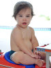 Valentino picture as he plays at the beach with his twin baby brother Matteo and father Ricky Martin