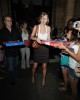 Taylor Swift hands out free Dominos pizza to the long lines of waiting fans outside her hotel in London on August 21st 2009