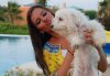 Lara Scandar picture with her puppy dog Pixy 4