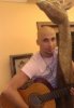 Mohamad Qwaider personal photo with his accoustic guitar